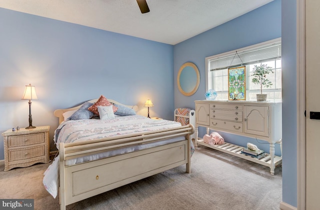 carpeted bedroom with a ceiling fan