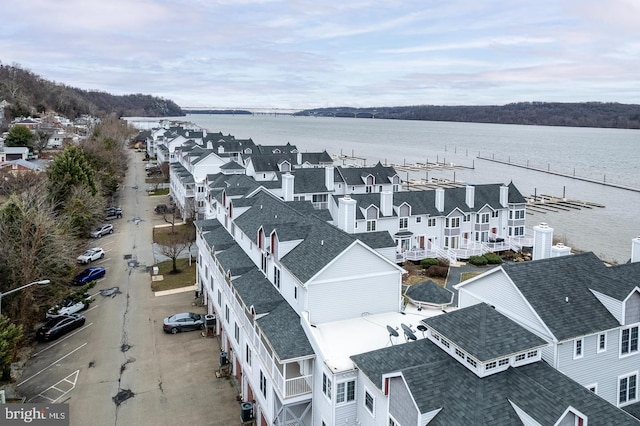 bird's eye view featuring a water view and a residential view