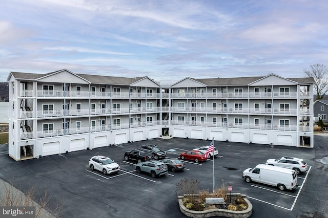 view of property featuring uncovered parking