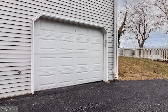 garage with fence