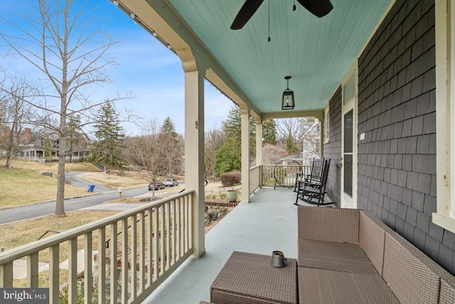 view of patio / terrace with ceiling fan and a porch