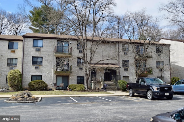 view of property with uncovered parking