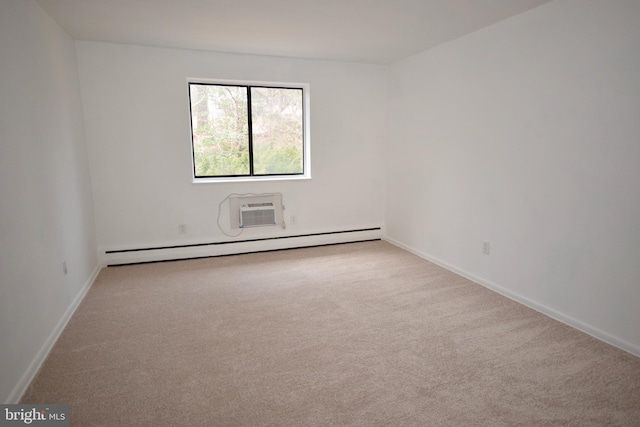 empty room with baseboard heating, carpet, a wall unit AC, and baseboards