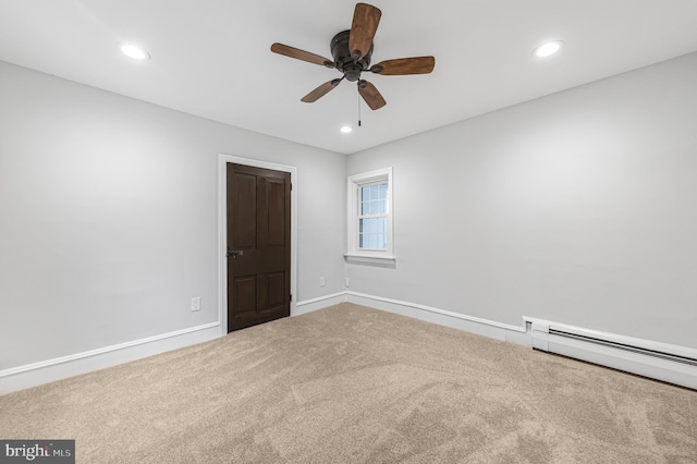 unfurnished bedroom featuring baseboard heating, recessed lighting, carpet flooring, and baseboards