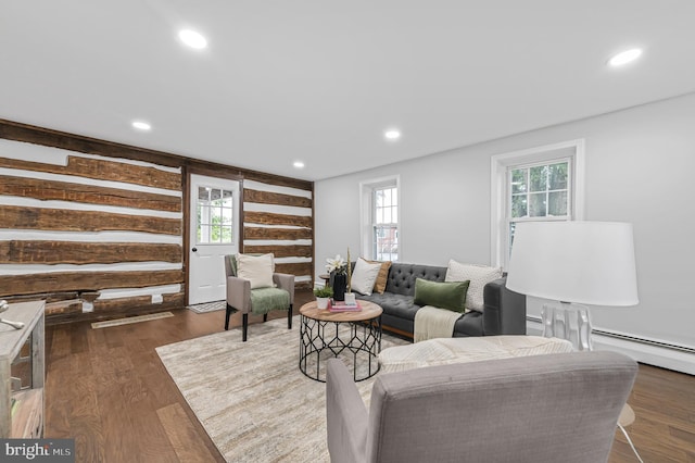 living area with recessed lighting and wood finished floors