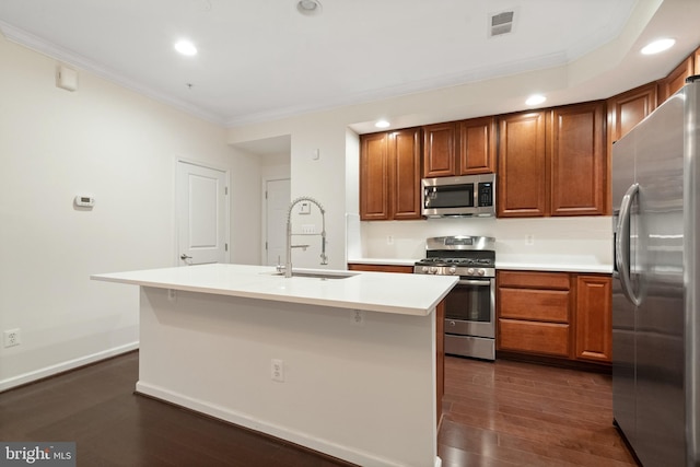 kitchen with a sink, ornamental molding, brown cabinets, appliances with stainless steel finishes, and dark wood-style flooring