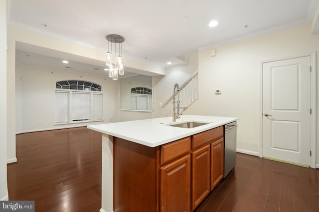 kitchen featuring brown cabinets, a sink, stainless steel dishwasher, open floor plan, and dark wood-style flooring