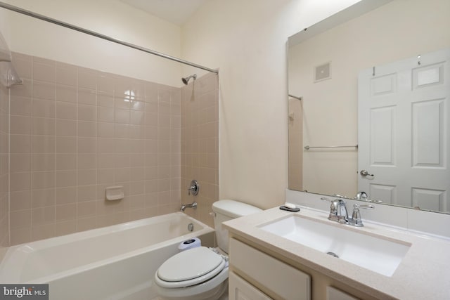 bathroom with visible vents, toilet, shower / washtub combination, and vanity