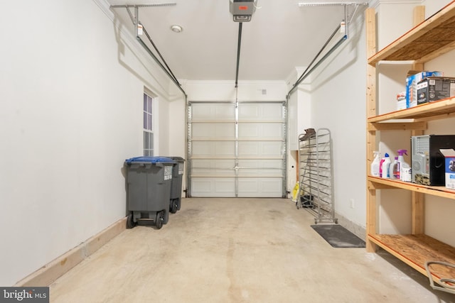 garage featuring a garage door opener and baseboards