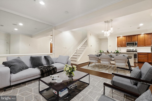 living room with crown molding, stairway, wood finished floors, and recessed lighting