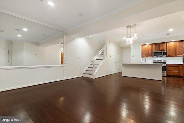 interior space featuring dark wood-style floors, open floor plan, and appliances with stainless steel finishes