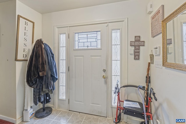 entryway with a wealth of natural light and baseboards