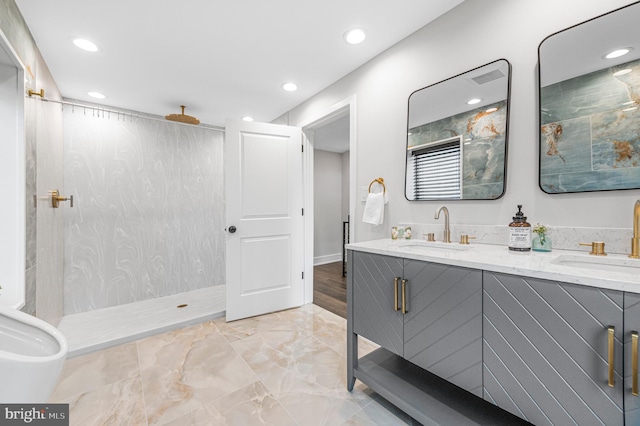 full bath featuring a walk in shower, double vanity, a sink, and recessed lighting