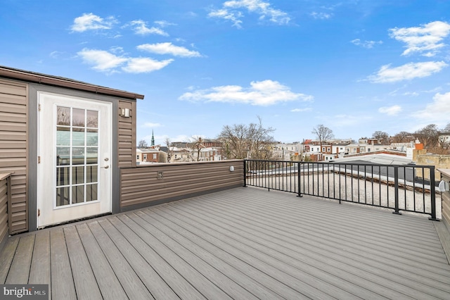 wooden terrace featuring a residential view