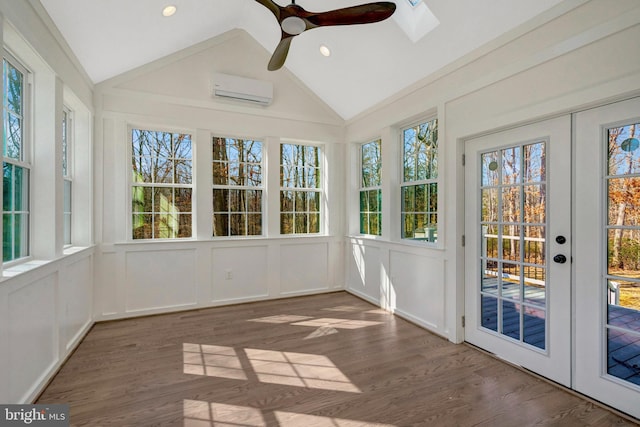 unfurnished sunroom with lofted ceiling, an AC wall unit, ceiling fan, and french doors