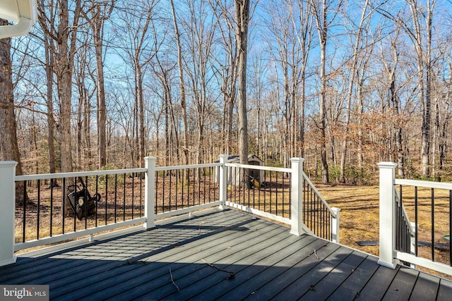 deck featuring a wooded view