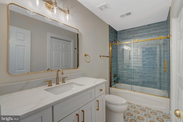 full bathroom with toilet, bath / shower combo with glass door, vanity, and visible vents