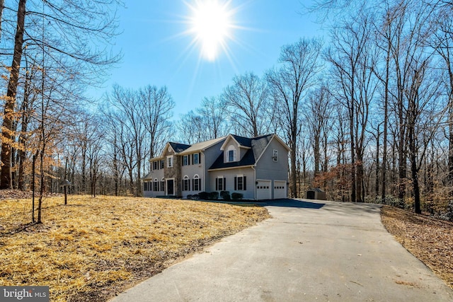 view of front of house featuring an attached garage and driveway