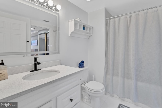 bathroom with visible vents, a shower with shower curtain, toilet, vanity, and tile patterned floors