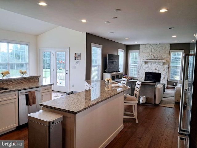 1392 Hickory Hill Rd, Chadds Ford, PA 19317 - kitchen featuring dark wood-style floors, recessed lighting, stainless steel dishwasher, open floor plan, and a stone fireplace