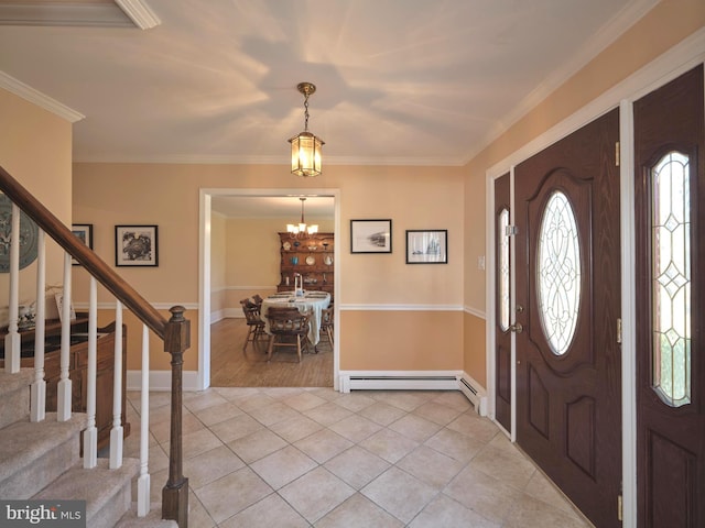 foyer featuring stairs, crown molding, light tile patterned floors, and a chandelier