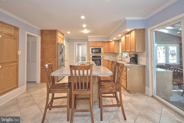 dining space featuring light tile patterned floors, baseboards, recessed lighting, and crown molding