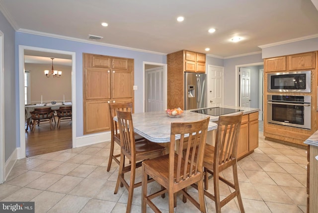 dining space with light tile patterned floors, visible vents, and ornamental molding