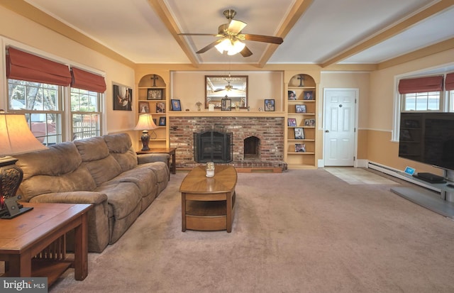 living area featuring a wealth of natural light, carpet floors, built in features, and a fireplace