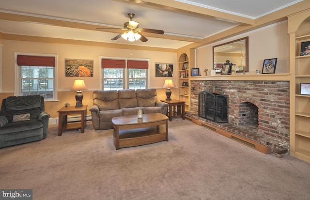 carpeted living room with built in features, a brick fireplace, crown molding, and a healthy amount of sunlight