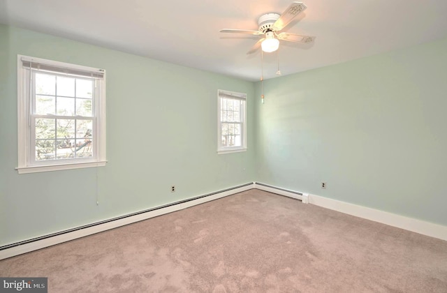 unfurnished room with a ceiling fan, baseboards, carpet floors, and a baseboard radiator