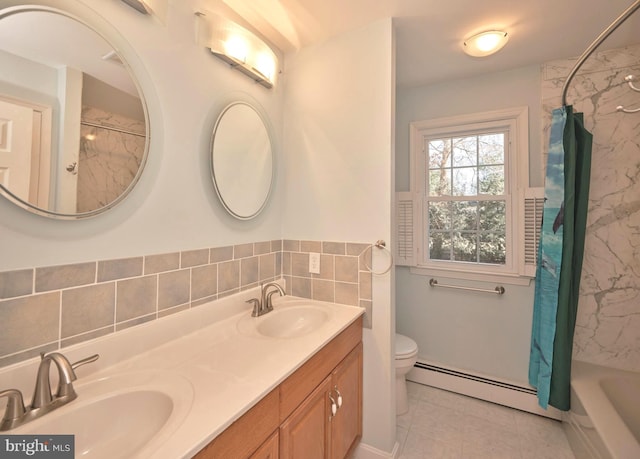 full bath featuring a sink, double vanity, toilet, and a baseboard radiator