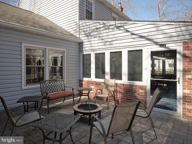 view of patio / terrace with a fire pit