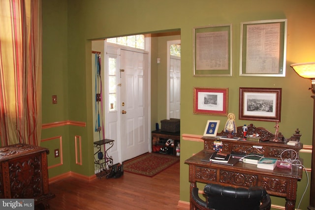 foyer featuring wood finished floors