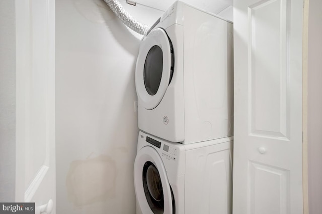 washroom with stacked washer / dryer