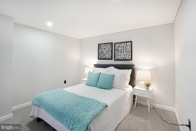 bedroom featuring baseboards and carpet flooring