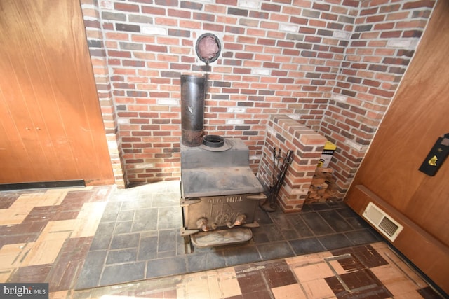 details with a wood stove and visible vents