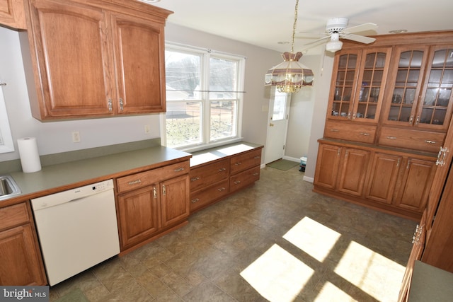 kitchen with a ceiling fan, hanging light fixtures, brown cabinets, dishwasher, and glass insert cabinets