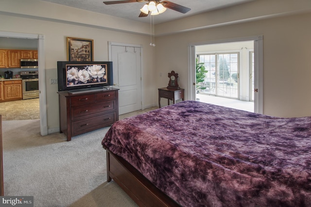 bedroom featuring light carpet and a ceiling fan