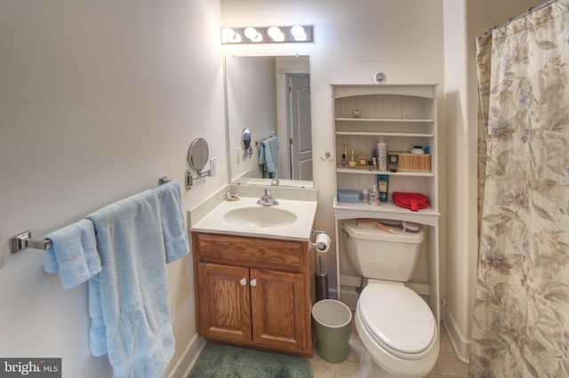 full bath featuring tile patterned flooring, vanity, and toilet