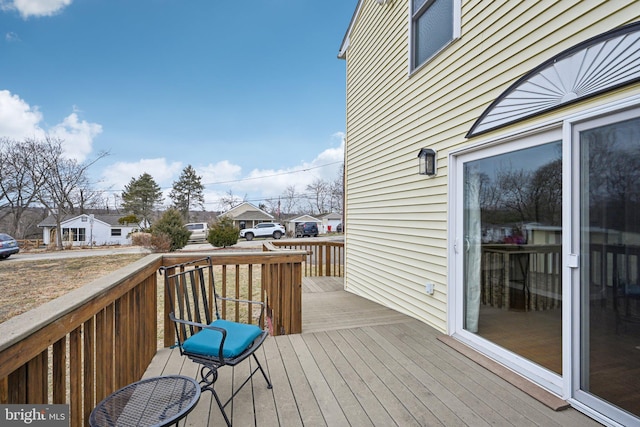 wooden deck with a residential view