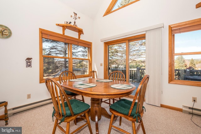 carpeted dining space with a baseboard heating unit, high vaulted ceiling, and baseboards