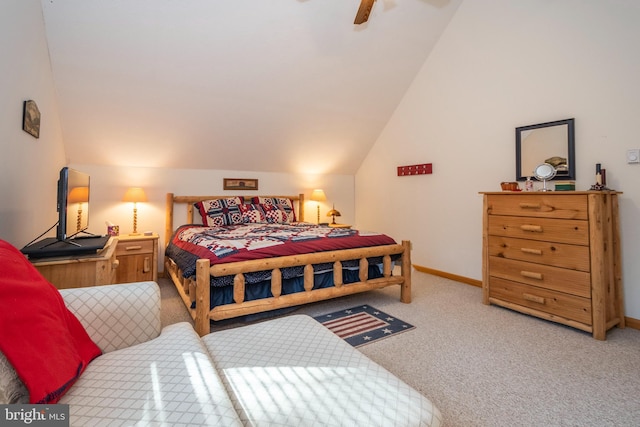 bedroom featuring baseboards, vaulted ceiling, a ceiling fan, and light colored carpet