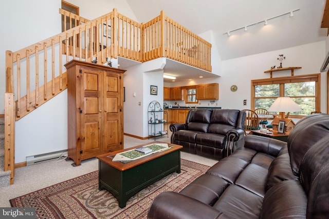 living room with light colored carpet, a baseboard heating unit, high vaulted ceiling, baseboards, and stairs