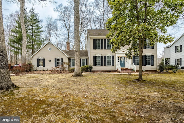 view of front of property featuring a chimney