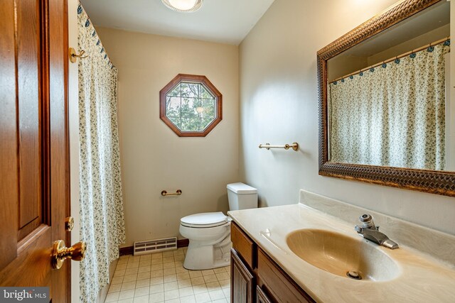 bathroom with toilet, tile patterned floors, vanity, visible vents, and a shower with curtain