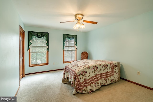 bedroom with carpet flooring, ceiling fan, and baseboards