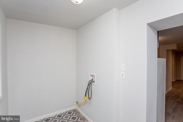 washroom with laundry area, washer hookup, and baseboards