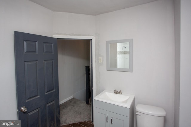 bathroom with toilet and vanity