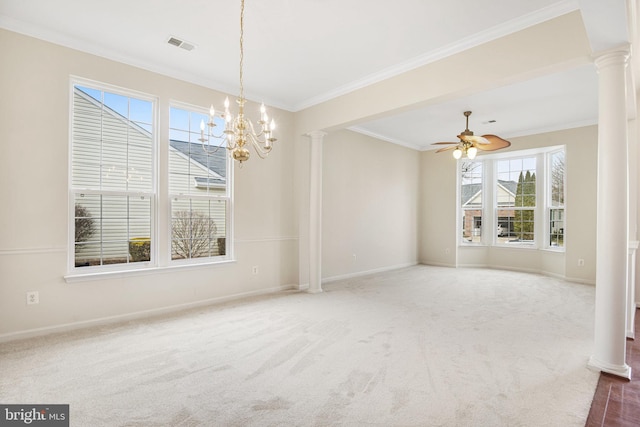 empty room featuring ornate columns, crown molding, visible vents, and carpet flooring