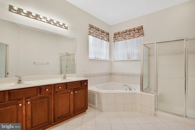 full bath featuring double vanity, a bath, tile patterned flooring, a shower stall, and a sink